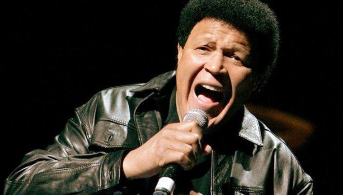 Chubby checker with a microphone
