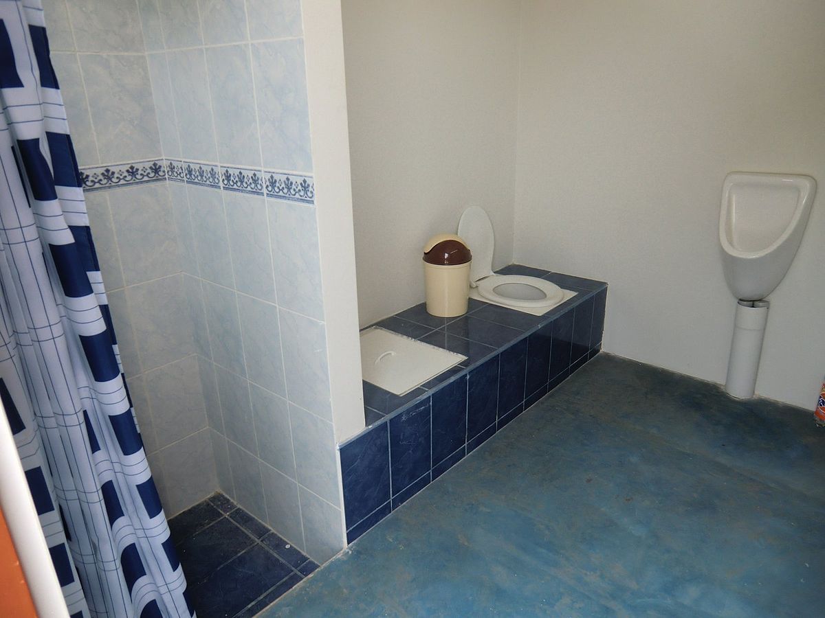 Community pee piss squat toilet type  photo